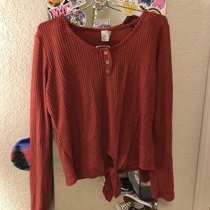 paper crane rusty orange sweater